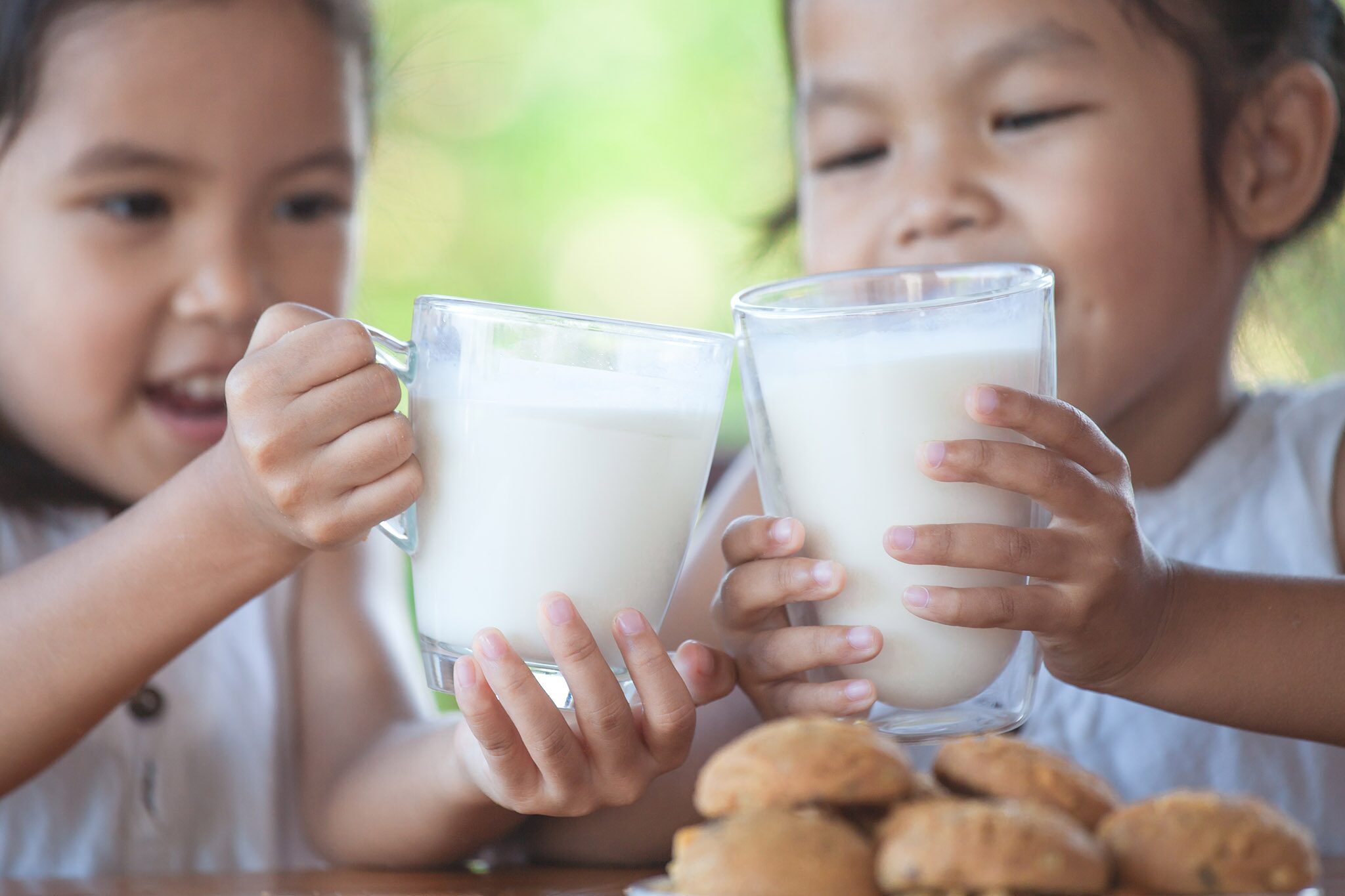 I drink milk for breakfast. Run out of Milk. Two Glasses of Milk. Ребенок держит стакан.